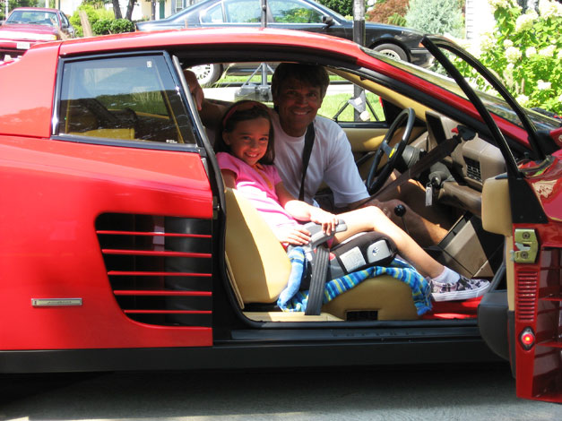 Franck Freon with his daughter Isabella in red Ferrari