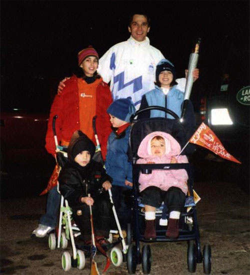 Franck Freon carries the torch at 2002 Winter Olympics